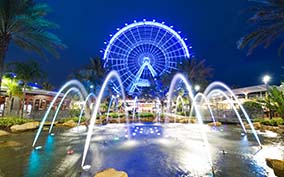 The Coca Cola Orlando Eye Ferris Wheel With Water falls at night